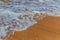 Closeup sandy sea coast with vawes