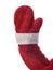Closeup of Santa Claus arm and hand in a red mitten, isolated on white