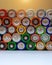 Closeup of saws of used alkaline batteries. Several in rows. Ecological pollution