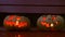 Closeup of scary halloween carved glowing pumpkins