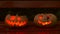 Closeup of scary halloween carved glowing pumpkins