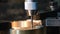 Closeup scene of machine tapping process on NC milling machine
