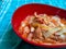 closeup of seblak food in a melamine bowl