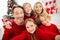 Closeup selfie photo of full big family five people meeting three little kids embrace toothy beaming smiling wear red