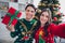 Closeup selfie photo of two youngsters people couple wear ugly nice sweaters hold box christmas tradition shopping
