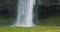 Closeup of Seljalandfoss waterfall Iceland in rainy moody weather