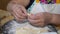 Closeup of senior woman cooking in the kitchen