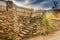 Closeup of a series of steps on a stone retaining wall in the countryside