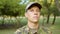 Closeup of serious male guard in military camouflage cap