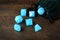 Closeup set blue d & d dice with green velvet bag