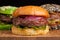 Closeup of set of three mini homemade Burger with marble beef and vegetables on a wooden Board