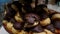 Closeup of several piled up chocolate cream puffs. Traditional sweet from Brazilian bakeries