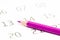 Closeup of a sharp purple pencil on a calendar with a blurry background