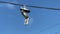 Closeup of shoes hanging from power lines.