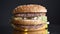 Closeup shoot of appetizing double cheeseburger with two juicy patties and the condiments