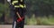 Closeup shoot of firefighter with axe walking outside