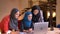 Closeup shoot of three friendly muslim female office workers checking on the laptop and getting happy and excited