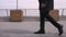 Closeup shoot of young african american businessman performing a moonwalk on the street in the urban city