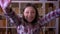 Closeup shoot of young attractive female student being excited and surprised looking at camera in the library indoors