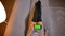 Closeup shoot of young teenage female holding the phone with green screen with ad on it. Girls legs in cute socks on the