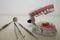 Closeup shot of acrylic human teeth model and medical equipment tools on a white surface