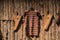 Closeup shot of ancient armour hanging on wooden background