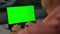 Closeup shot of anonymous man watching mockup laptop at home back view.