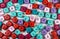 Closeup shot of an array of colorful cubic beads with letters