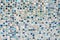 Closeup shot of a background with small blue broke tiles