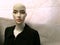 Closeup shot of a bald female mannequin in a jacket