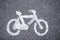 Closeup shot of bikes lane signal on an asphalt street