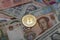 Closeup shot of Bitcoin on cash - Physical bitcoin, Digital currency, Cryptocurrency