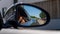 Closeup shot of a black car corner mirror