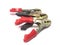 Closeup shot of black and red cable cutters under the lights isolated on a white background