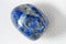 Closeup shot of a blue azurite stone on a white background