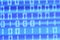 Closeup shot of a blue blurred screen displaying binary codes - a digital concept