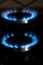 Closeup shot of blue fire from domestic kitchen stove top. Burning gas, gas stove burner. Gas cooker with burning flames of