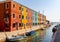 Closeup shot of boats in the water and colorful buildings in Venice, Italy