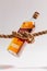 Closeup shot of a bottle of whiskey tied with a tight rope on a white background