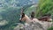 Closeup shot of a brown feral goat in a mountain landscape