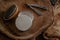 Closeup shot of brush, shaving knife and foam on a wooden surface