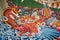 Closeup shot of a Buddhist painting with mural dragons