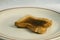 Closeup shot of a burnt toast on a plate