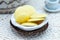 Closeup shot of butter slices in a rustic bowl