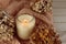 Closeup shot of a calming scented candle on the woolen sweater