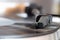 Closeup shot of a cartridge in a portable gramophone with a blurred background