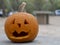 Closeup shot of a carved spooky Halloween pumpkin lantern on a blurred background