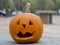 Closeup shot of a carved spooky Halloween pumpkin lantern on a blurred background