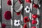 Closeup shot of a chain of knitted poppies on a fence