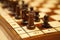 Closeup shot of a chessboard with the focus on black\\\'s rook and pawn